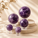 Amethyst spheres by Talk to Crystals, available in various sizes, featuring natural healing crystals for restful sleep, stress relief, anxiety relief, intuition, meditation, and Crown Chakra healing in India