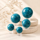 Blue Apatite spheres by Talk to Crystals, available in various sizes, featuring natural healing crystals for manifestation, personal power, mental clarity, communication, psychic perception, and Throat Chakra healing in India