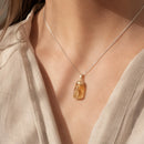 Citrine tumble stone pendant by Talk to Crystals featuring natural gemstone jewellery for wealth, abundance, career growth, manifestation, confidence, joy, and Solar Plexus Chakra healing in India