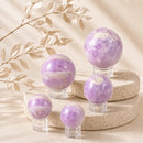 Kunzite spheres by Talk to Crystals, available in various sizes, featuring natural healing crystals for emotional healing, self-love, compassion, unconditional love, and Heart Chakra healing in India