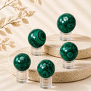 Malachite spheres by Talk to Crystals, available in various sizes, featuring natural healing crystals for transformation, protection, emotional healing, personal growth, and Heart Chakra healing in India