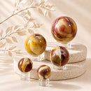 Mookaite Jasper spheres by Talk to Crystals, available in various sizes, featuring natural healing crystals for strength, confidence, embracing change, decision-making, vitality, and Root Chakra healing in India