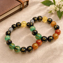 Om Mani Seven Chakra bracelet by Talk to Crystals with Onyx beads and Buddhist chant symbol for seven chakra balance and calm