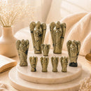 Natural Pyrite angel carvings by Talk to Crystals for wealth, abundance, prosperity, confidence, protection and positive energy, available in various sizes.