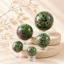 Ruby Zoisite spheres by Talk to Crystals, available in various sizes, featuring natural healing crystals for vitality, personal growth, passion, intuition, Heart Chakra healing, and spiritual growth in India