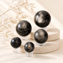 Silver Sheen Obsidian spheres by Talk to Crystals, available in various sizes, featuring natural healing crystals for psychic protection, intuition, uncovering hidden truths, grounding, meditation, and spiritual growth in India