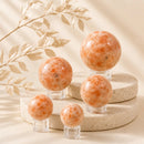 Sunstone spheres by Talk to Crystals, available in various sizes, featuring natural healing crystals for joy, confidence, leadership, personal power, optimism, and Solar Plexus Chakra healing in India