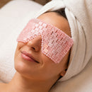 Woman wearing a Rose Quartz crystal eye mask