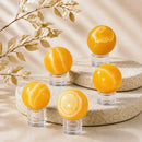 Yellow Banded Calcite spheres by Talk to Crystals, available in various sizes, featuring natural healing crystals for confidence, motivation, optimism, personal power, and Solar Plexus Chakra healing in India