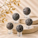 Discover Yooperlite spheres by Talk to Crystals for truth, communication, transformation, and emotional balance. Available in various sizes for crystal healing and home décor